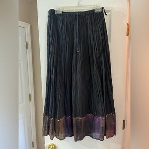 Black skirt with glittery design on bottom. Size medium, perfect condition.